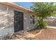 Inviting home entrance with a secure iron gate and well-kept yard at 7619 W Clarendon Ave, Phoenix, AZ 85033