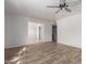 Open-concept living space with new wood-look floors and neutral paint at 7619 W Clarendon Ave, Phoenix, AZ 85033