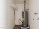 The utility room features a water heater and some shelving for storage at 7619 W Clarendon Ave, Phoenix, AZ 85033