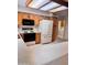 Bright kitchen featuring oak cabinets, white appliances, and convenient access to the laundry room at 8161 E Keats Ave # 376, Mesa, AZ 85209