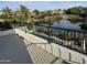 Scenic backyard view overlooking a tranquil lake and lush landscaping at 861 E Canyon Way, Chandler, AZ 85249