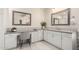 Bathroom vanity with framed mirrors, quartz countertops, white cabinets, and decorative backsplash at 861 E Canyon Way, Chandler, AZ 85249