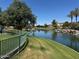 Lush lakeside path within the community, featuring a view of the serene water and landscape at 861 E Canyon Way, Chandler, AZ 85249