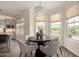 Cozy dining area with a round table, chandelier, and view of the pool at 861 E Canyon Way, Chandler, AZ 85249