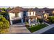 Impressive home with a well-manicured lawn, charming stone accents, and a spacious driveway, creating a welcoming curb appeal at 861 E Canyon Way, Chandler, AZ 85249
