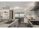 Modern kitchen featuring stainless steel appliances, white and grey cabinets and stone countertops at 861 E Canyon Way, Chandler, AZ 85249