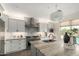 Bright kitchen with stainless steel appliances, a large island, and modern finishes at 861 E Canyon Way, Chandler, AZ 85249