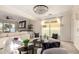 Elegant living room with fireplace, modern chandelier and neutral décor at 861 E Canyon Way, Chandler, AZ 85249
