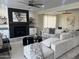 Spacious living room featuring a cozy fireplace and comfortable sectional seating at 861 E Canyon Way, Chandler, AZ 85249