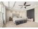 Main bedroom featuring a tray ceiling, carpet flooring, ceiling fan and seating area at 861 E Canyon Way, Chandler, AZ 85249