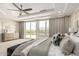 Spacious main bedroom with ceiling fan, tray ceiling, and outside view at 861 E Canyon Way, Chandler, AZ 85249