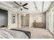 Spacious main bedroom with ceiling fan, tray ceiling, and large dresser at 861 E Canyon Way, Chandler, AZ 85249