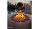 Inviting pool area with a fire pit and comfortable outdoor seating at 861 E Canyon Way, Chandler, AZ 85249
