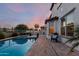 Inviting backyard with pool, spa, patio, landscaping, grill and comfortable seating at 861 E Canyon Way, Chandler, AZ 85249