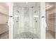 Modern bathroom shower with dual shower heads and mosaic tile floor and accent wall at 861 E Canyon Way, Chandler, AZ 85249