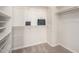 Walk-in closet with shelving, hanging racks, and carpet flooring at 861 E Canyon Way, Chandler, AZ 85249
