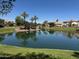 Scenic waterfront community view with lush green landscaping and beautiful blue water, perfect for serene living at 861 E Canyon Way, Chandler, AZ 85249