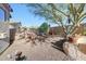 Picturesque backyard featuring gravel, stone block wall and desert landscaping at 8687 W Bajada Rd, Peoria, AZ 85383