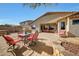 Picturesque backyard featuring patio with outdoor furniture and fire pit at 8687 W Bajada Rd, Peoria, AZ 85383