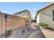 Landscaped backyard featuring gravel, stone block wall and desert landscaping at 8687 W Bajada Rd, Peoria, AZ 85383