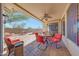 Covered patio area with ceiling fan, outdoor furniture, and barbeque area with a view at 8687 W Bajada Rd, Peoria, AZ 85383