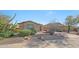 Single story desert home boasts xeriscaping, gravel and mature cacti and desert plants at 8687 W Bajada Rd, Peoria, AZ 85383