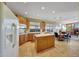 Spacious kitchen with island, tile floors, and breakfast nook that looks out to the living room at 8687 W Bajada Rd, Peoria, AZ 85383