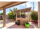 A charming backyard has a gazebo surrounded by lush flowers, perfect for outdoor enjoyment at 940 S Revere --, Mesa, AZ 85210