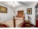 Cozy bedroom with a four-poster bed, wood floors, and a ceiling fan at 940 S Revere --, Mesa, AZ 85210