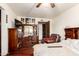 Bedroom featuring wood floors, ceiling fan, and classic wooden furniture at 940 S Revere --, Mesa, AZ 85210