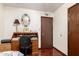 This bedroom features a desk, a wood floor and traditional decor at 940 S Revere --, Mesa, AZ 85210