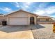Charming single-story home with a brick facade, desert landscaping, and a two-car garage at 940 S Revere --, Mesa, AZ 85210