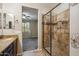 Bathroom features a tiled walk-in shower and a glimpse into the bedroom with a fan at 9921 E Acceleration Dr, Mesa, AZ 85212