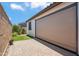 Relaxing covered patio with a fully retracted shade and brick pavers overlooking the backyard at 9921 E Acceleration Dr, Mesa, AZ 85212