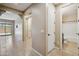 Hallway with an archway view into the open floorplan living area and bathroom at 9921 E Acceleration Dr, Mesa, AZ 85212