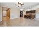 Spacious living area featuring an open layout with kitchen island and tile flooring at 9921 E Acceleration Dr, Mesa, AZ 85212