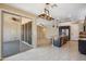 Open floorplan living area featuring a kitchen with stainless appliances and access to backyard patio at 9921 E Acceleration Dr, Mesa, AZ 85212
