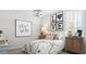 Cozy bedroom with modern decor and a decorative chandelier light at 10043 S 23Rd Dr, Phoenix, AZ 85041