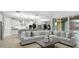 Spacious living room connected to the kitchen with tile floors and sliding glass doors at 10043 S 23Rd Dr, Phoenix, AZ 85041