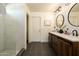 Elegantly renovated bathroom featuring a dual sink vanity, modern fixtures, and a spacious walk-in shower at 10284 E Mallow Cir, Scottsdale, AZ 85255