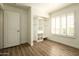 Minimalist bedroom with closet storage, and a large window at 10284 E Mallow Cir, Scottsdale, AZ 85255