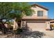 Charming two-story home featuring a tile roof, mature landscaping and a welcoming front entrance at 10284 E Mallow Cir, Scottsdale, AZ 85255