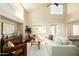 Bright living room with high ceilings, neutral decor, and an abundance of natural light at 10284 E Mallow Cir, Scottsdale, AZ 85255