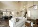 Bright living room with high ceilings, neutral decor, staircase, and open floorplan at 10284 E Mallow Cir, Scottsdale, AZ 85255