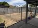 The backyard features a chain link dog run with direct access to the covered patio at 11221 N 91St Dr, Peoria, AZ 85345