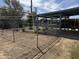 Backyard with covered patio, garden, and chain link dog run at 11221 N 91St Dr, Peoria, AZ 85345