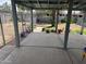 Covered patio looking onto the yard, plants, and a chain link fence at 11221 N 91St Dr, Peoria, AZ 85345