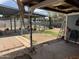 View of the backyard and patio area, complete with a wooden table and chairs at 11221 N 91St Dr, Peoria, AZ 85345