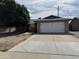 Charming single-story home featuring a two-car garage and a well-maintained front yard at 11221 N 91St Dr, Peoria, AZ 85345