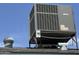 Rooftop HVAC unit against a bright blue sky at 11221 N 91St Dr, Peoria, AZ 85345